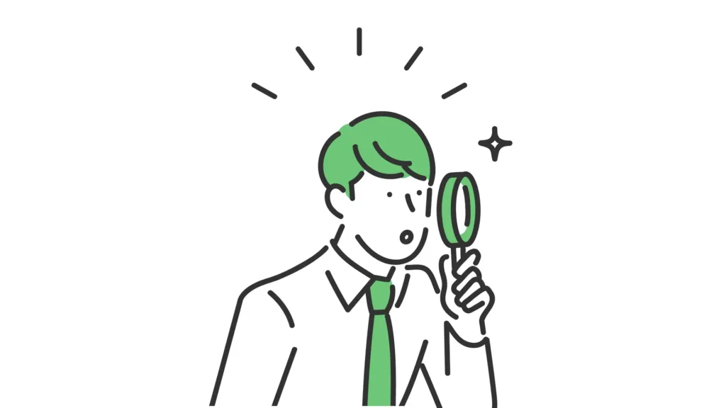 虫眼鏡を覗く男性